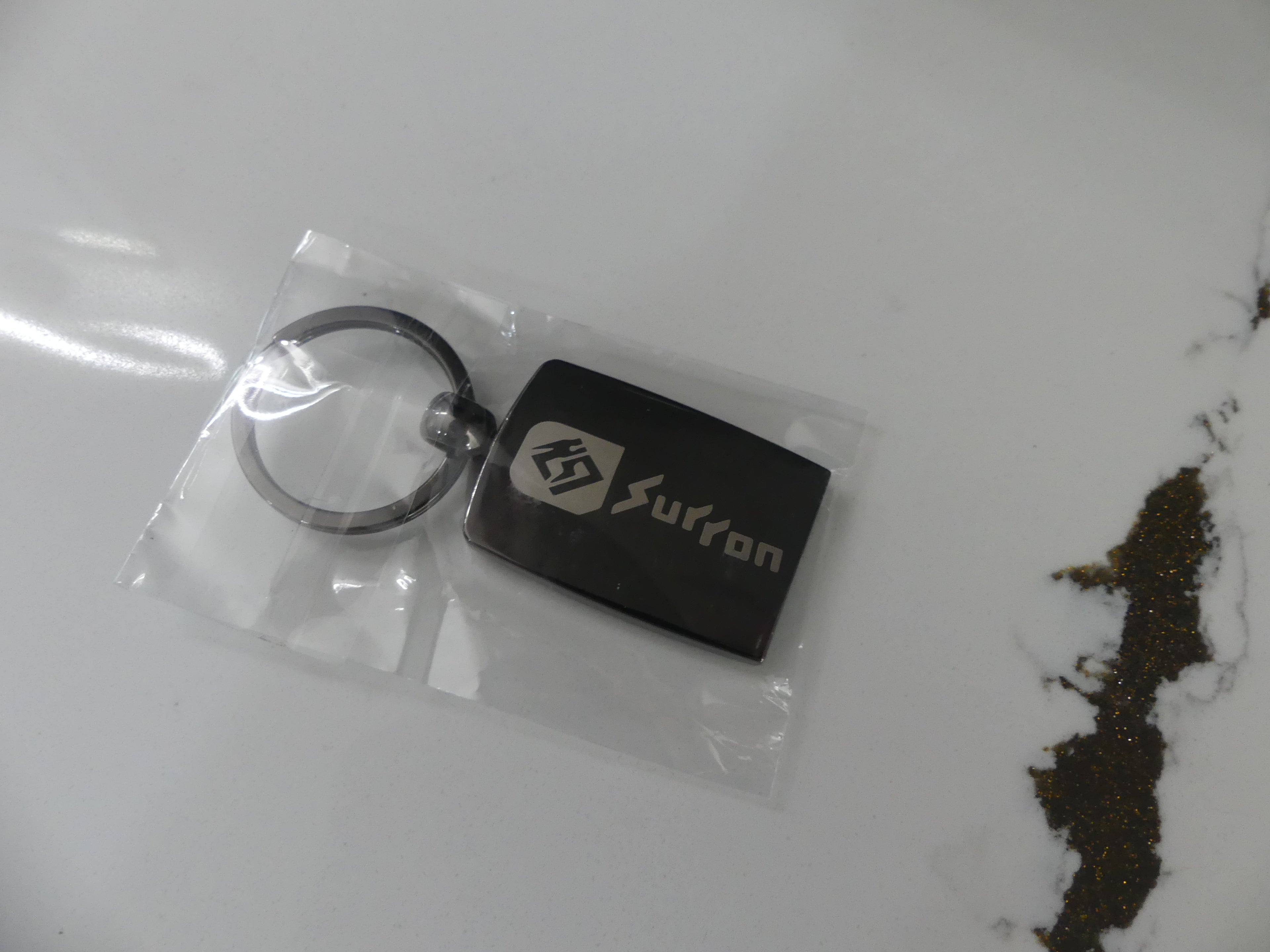 Carbon Fiber Surron Keychain