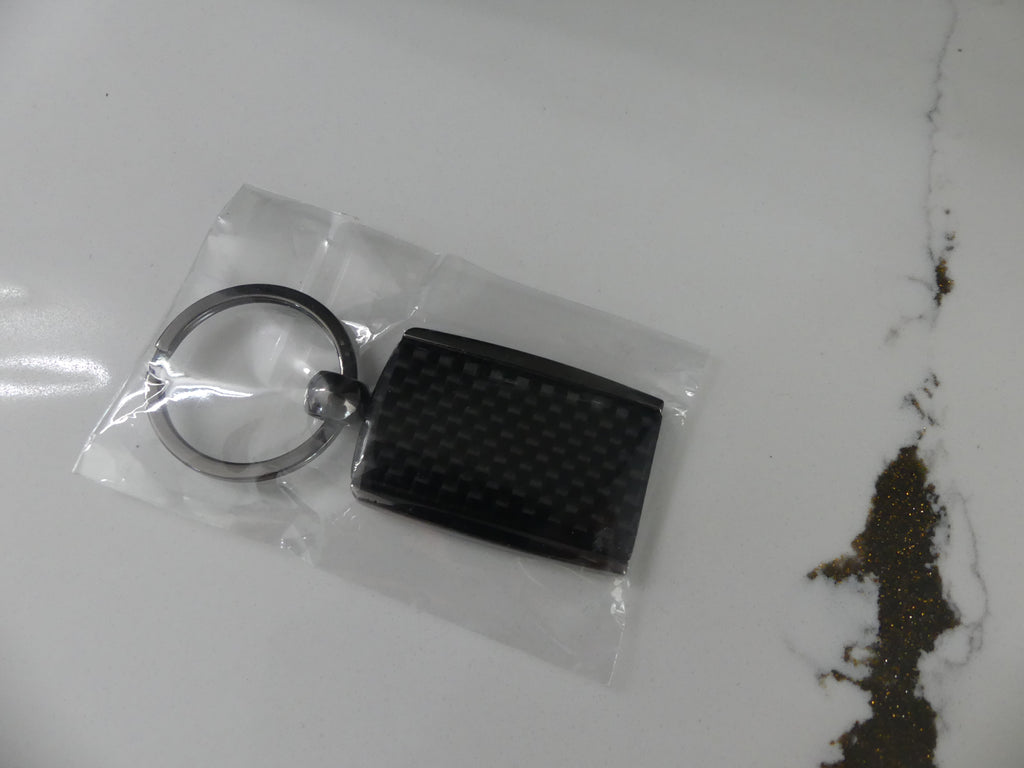 Carbon Fiber Surron Keychain