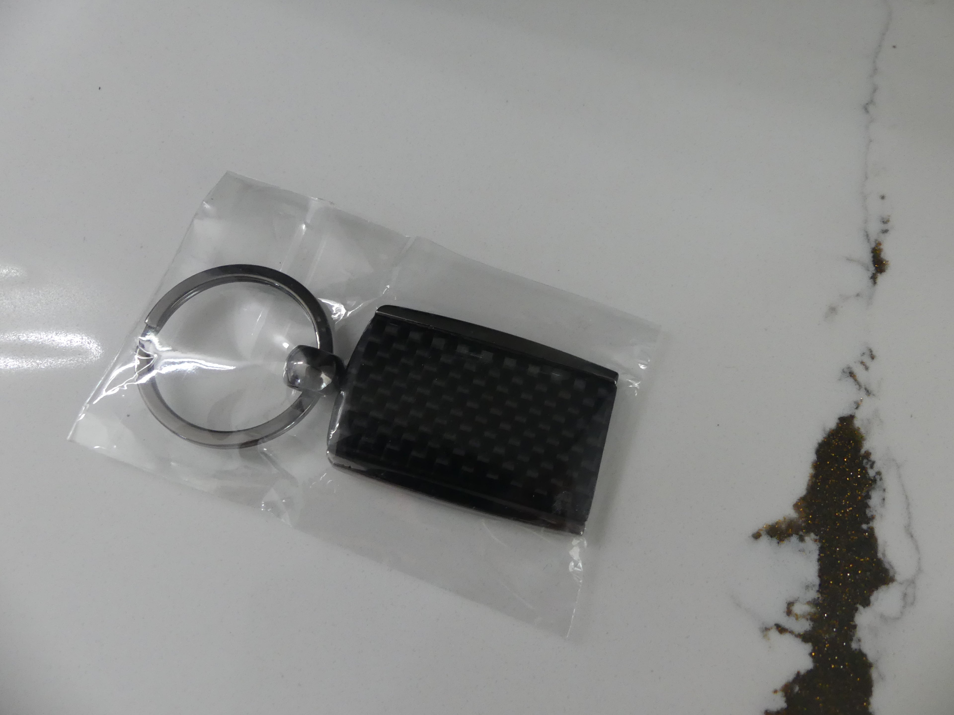 Carbon Fiber Surron Keychain