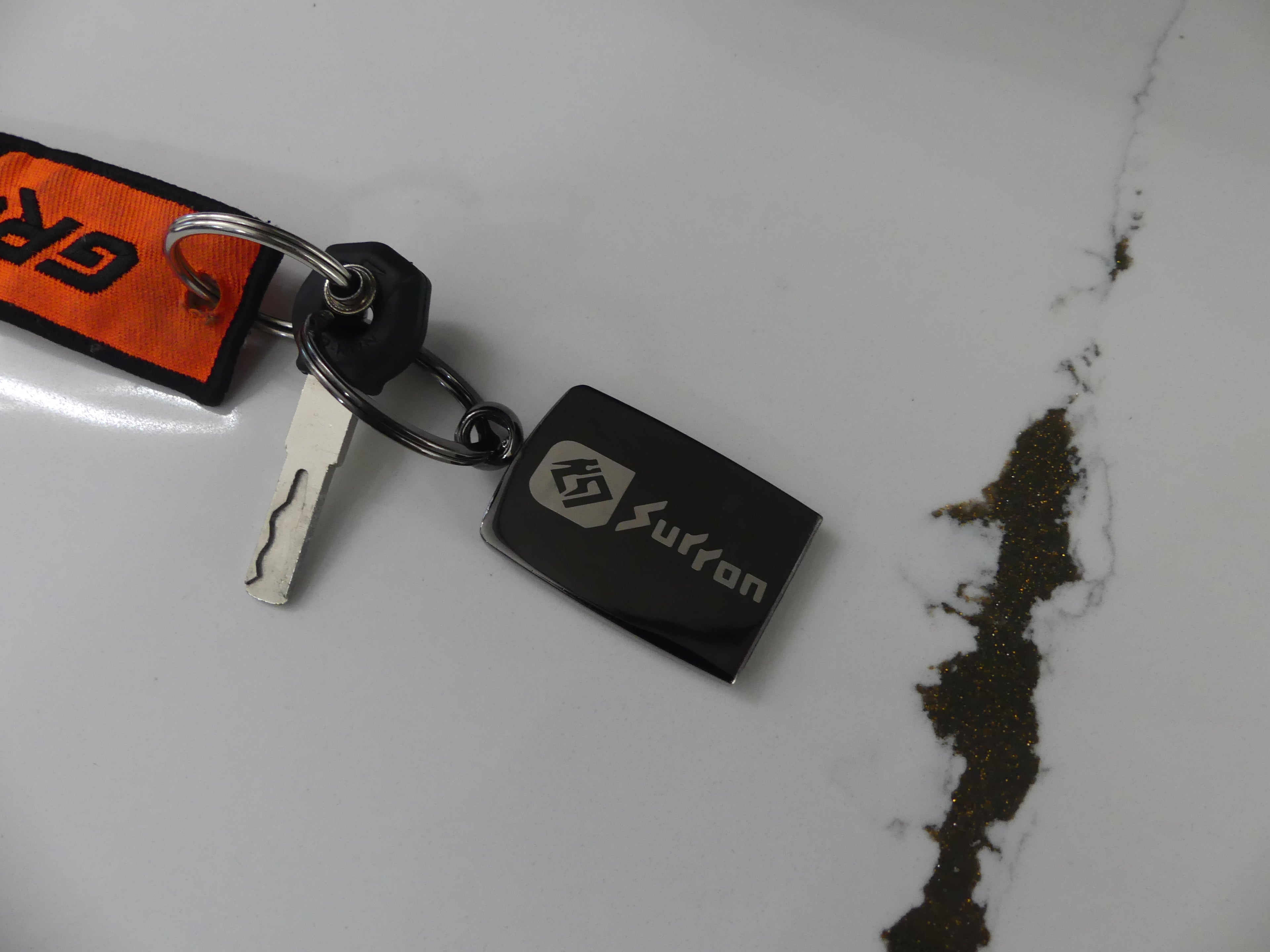 Carbon Fiber Surron Keychain