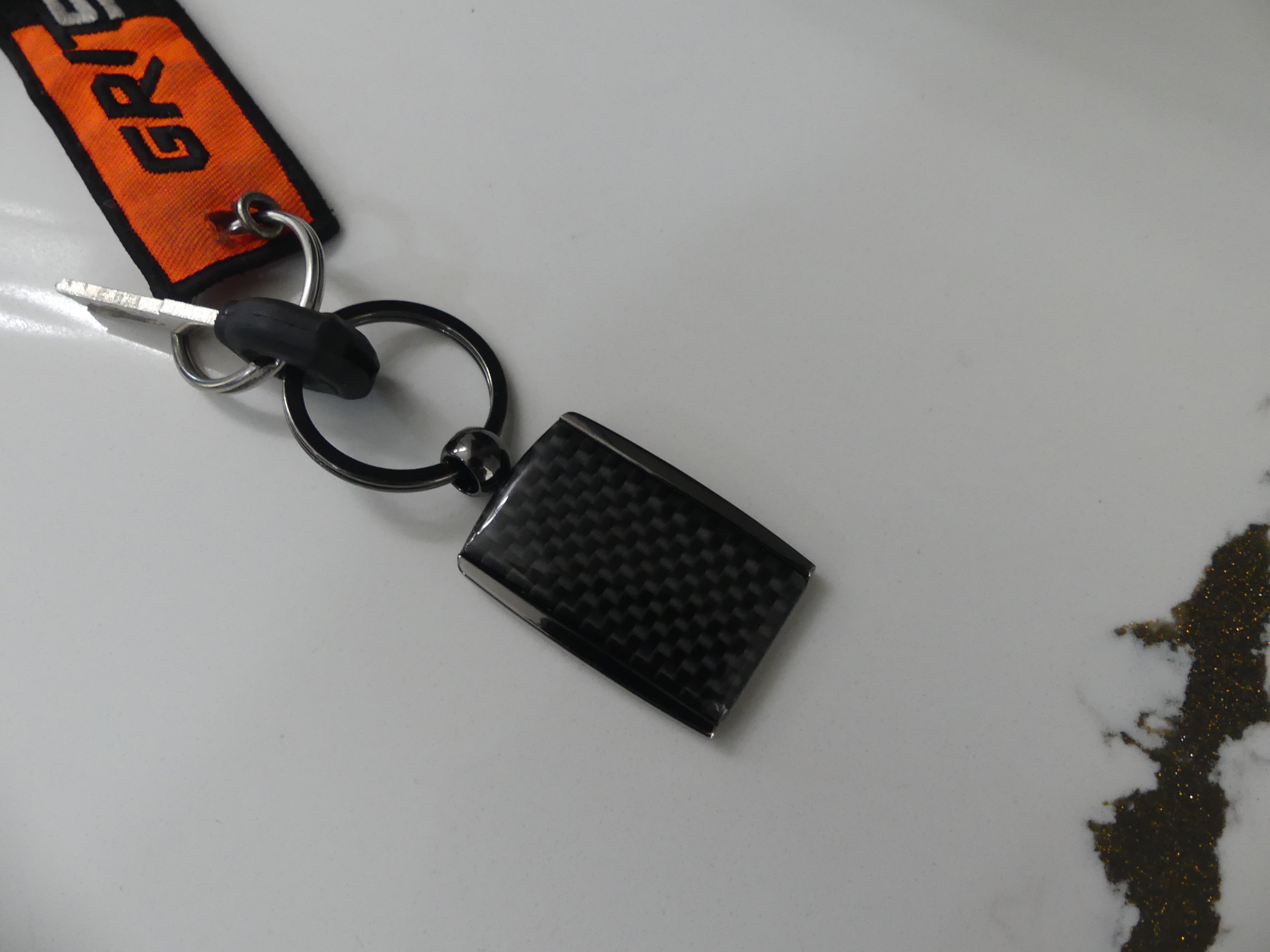 Carbon Fiber Surron Keychain